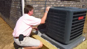 Home Inspector in Raleigh inspecting a heating system during fall maintenance.