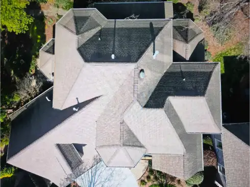 Inspection drone in flight above a home