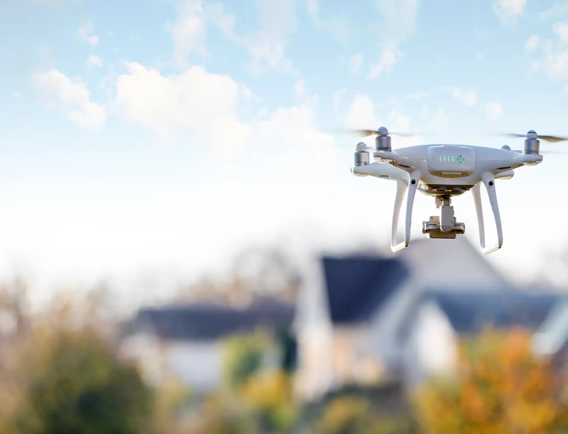 Drone capturing photographs of a roof surface
