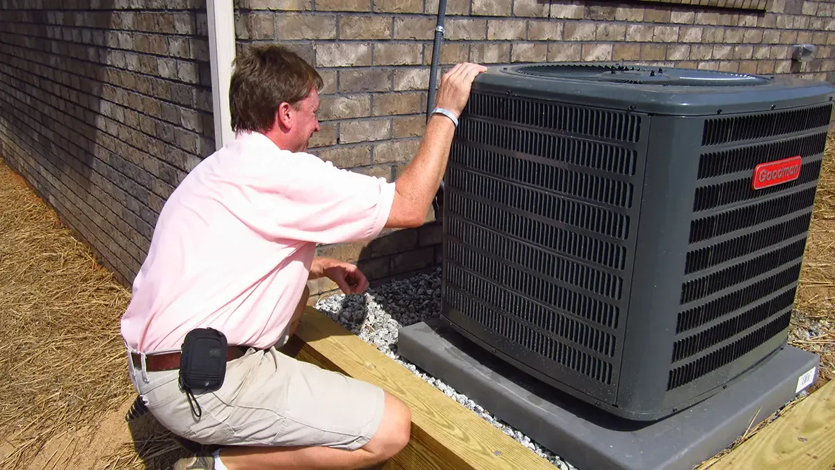Home Inspector in Raleigh inspecting a heating system during fall maintenance.