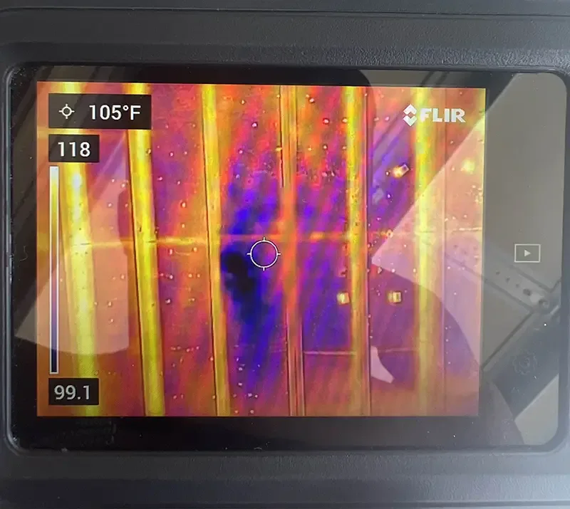 Thermal camera showing hidden moisture inside a Charlotte home wall